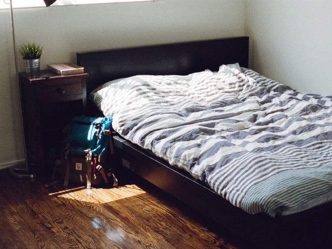 A bed and bedside table